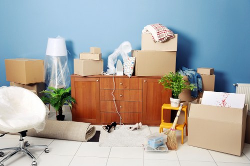Removal van and moving team working in a Clerkenwell street