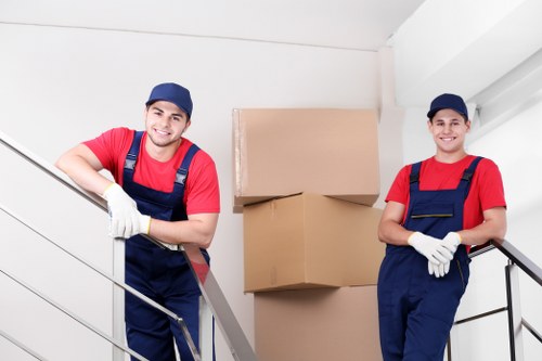 Moving team loading furniture safely with protective coverings