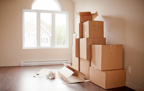 Removal team handling a move in a Clerkenwell street with local buildings nearby