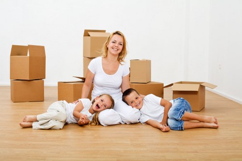 Boxes, office furniture, and equipment prepared for a business move