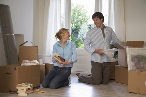 Courier checking load safety before transport in a van